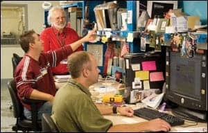 Paul Sherman (standing), and left to right VA biomedical engineering technicians John A. Waldmann, and Derek Carr.